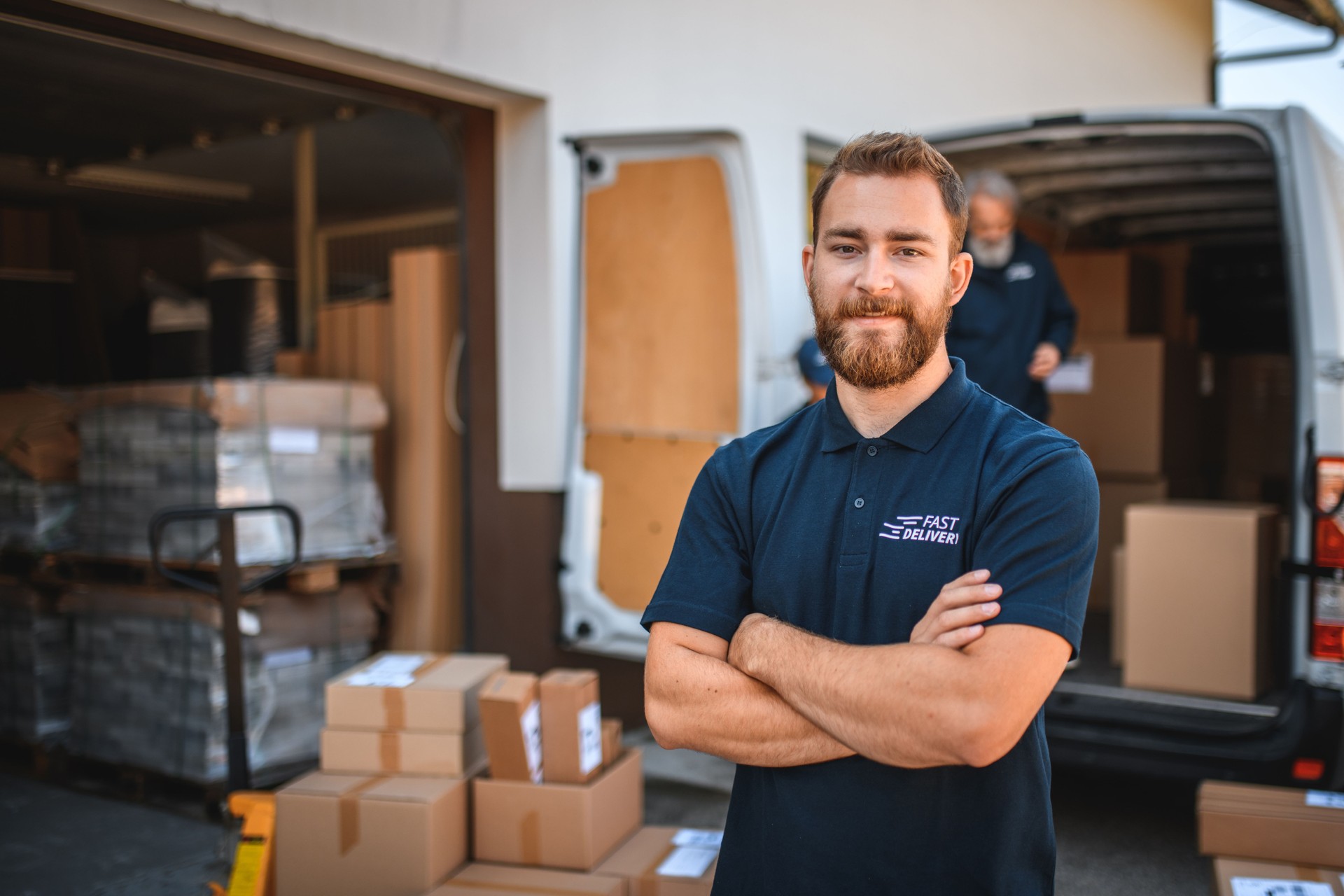 Portrait Of Young Male Delivery Worker Looking At Camera